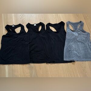 Bundle of four size M Athletica Momentum tank tops